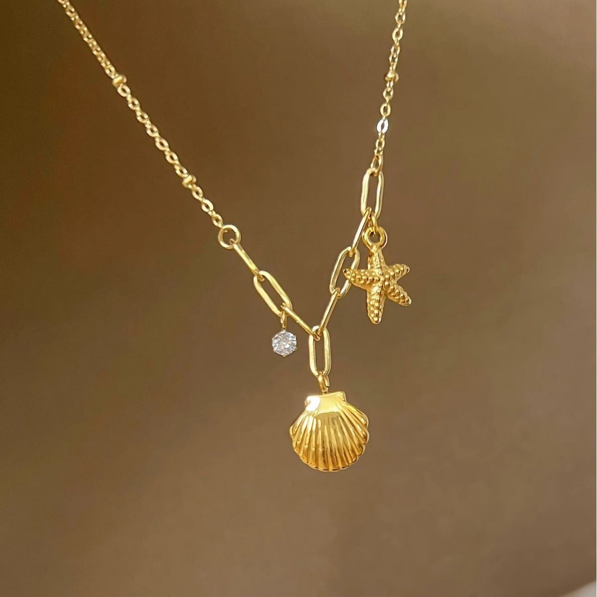 Golden Starfish & Shell Titanium Steel Necklace – Ocean-Inspired Elegance