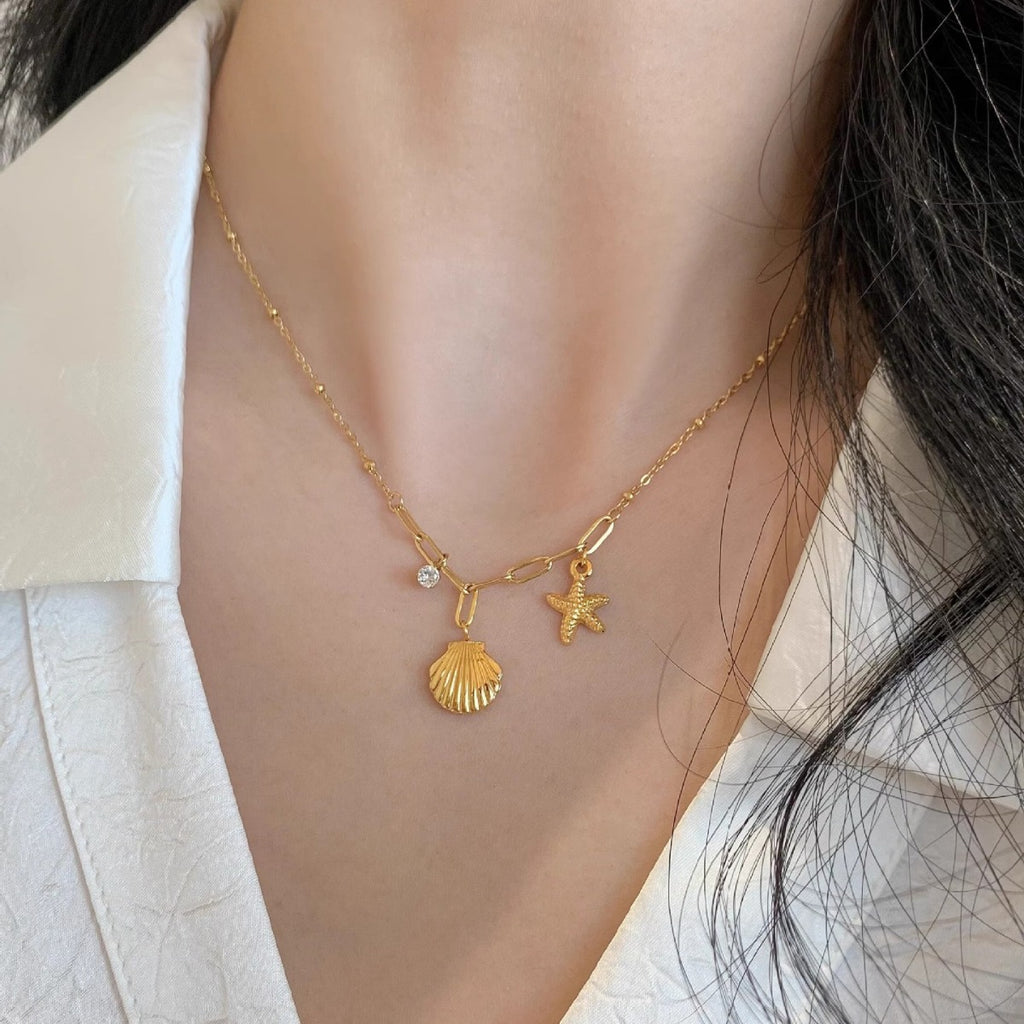 Golden Starfish & Shell Titanium Steel Necklace – Ocean-Inspired Elegance